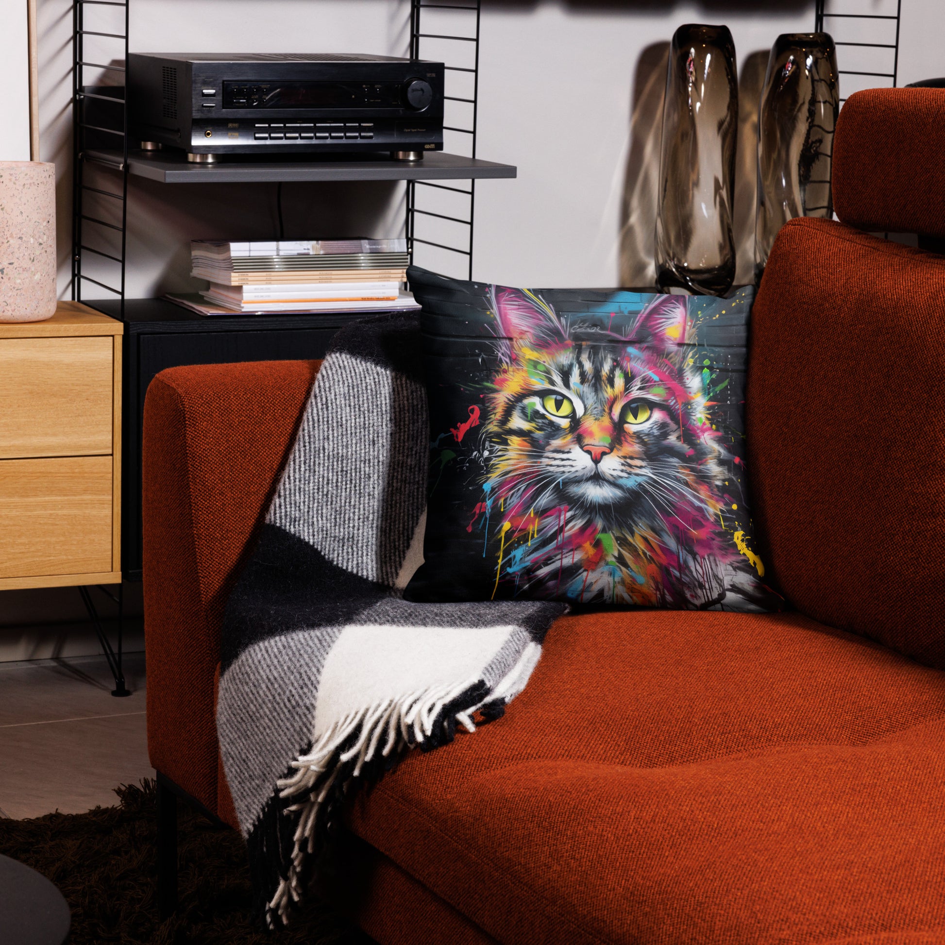 Urban graffiti cat pillow styled on couch in colorful living room